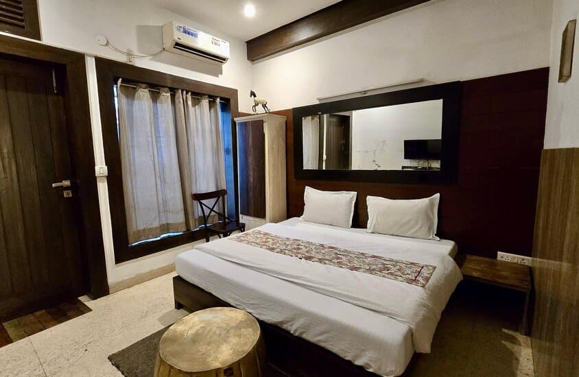 Deluxe Room with king bed and writing desk at Aakriti Hotels, Sector 23 Gurugram