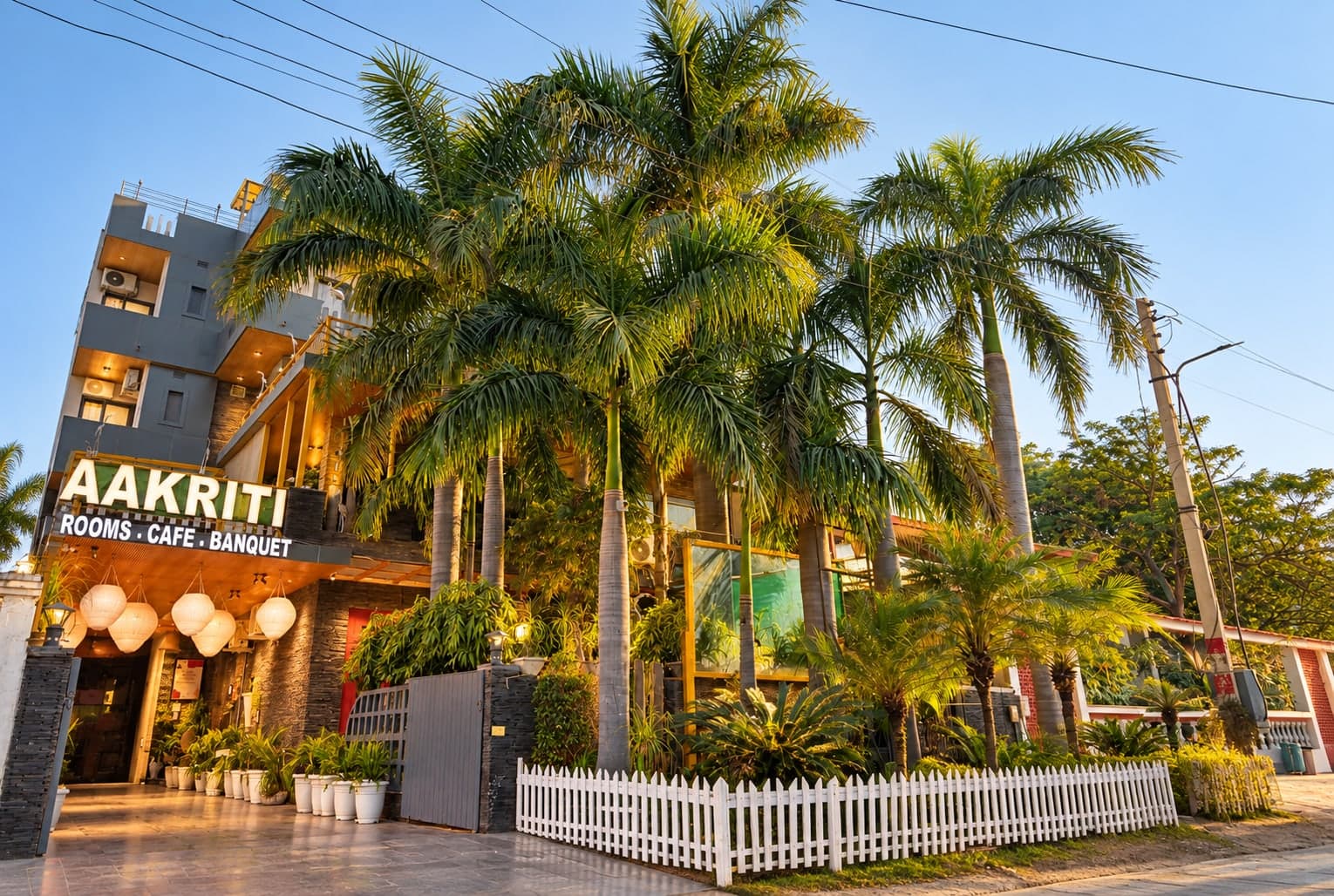 Aakriti Hotels and its cafe seen from the street, Sector 23 Gurugram