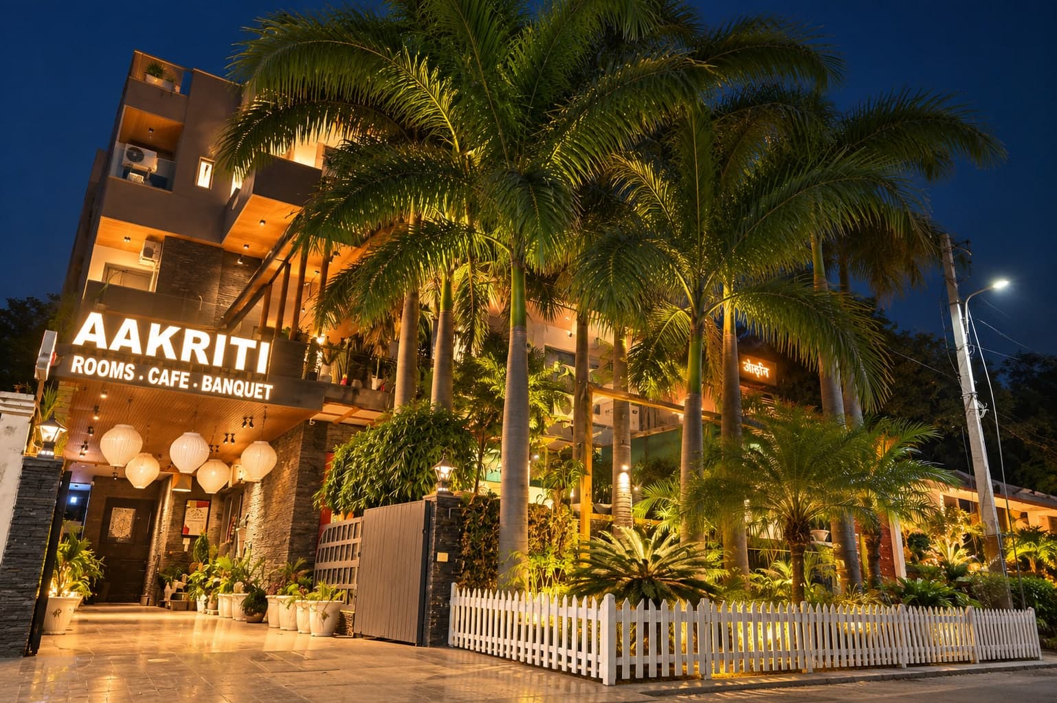 The palm-lined frontage of Aakriti Hotels, Gurugram