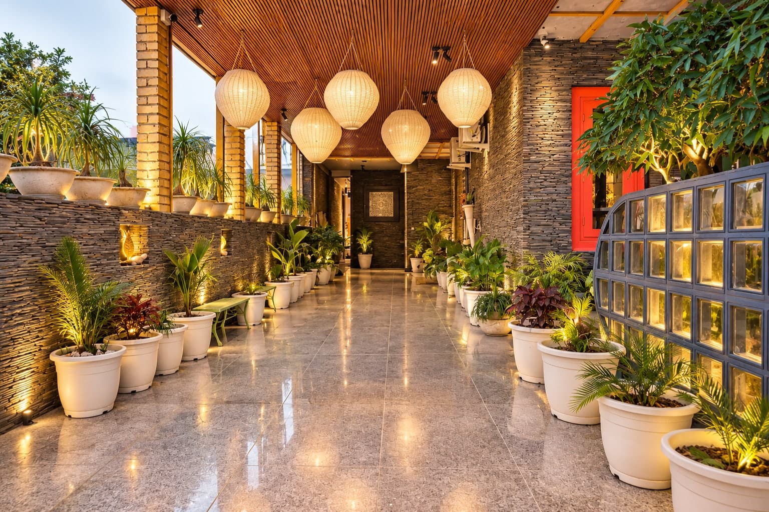 The lantern-lit veranda entrance at Aakriti Hotels