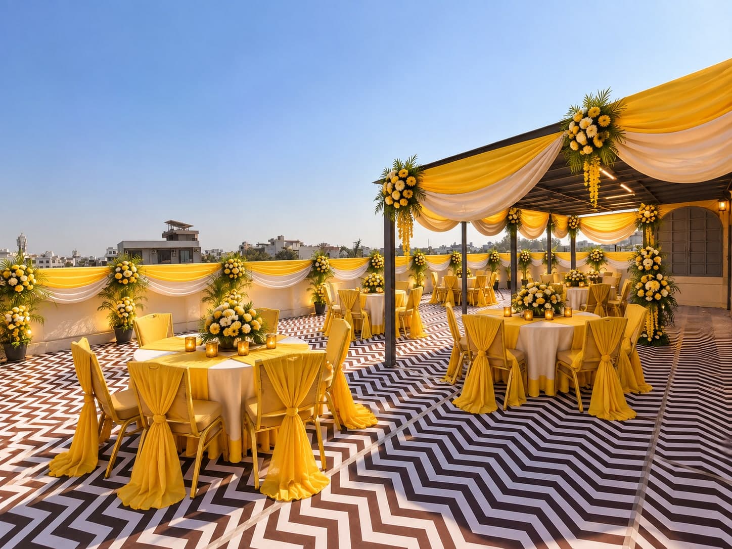 Rooftop reception in yellow and white at Aakriti Hotels