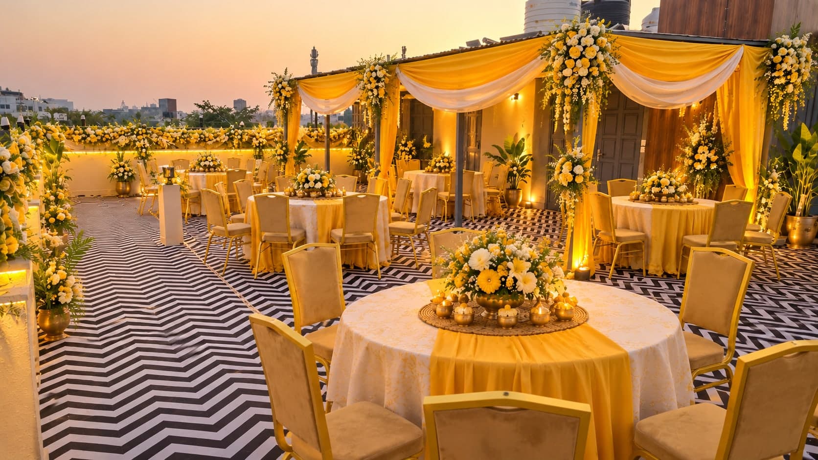 The rooftop venue at Aakriti Hotels set for a wedding reception at sunset, Gurugram